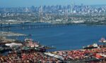 The island of Manhattan, Jersey City, Newark Bay, and areas of the New York / New Jersey Port seen from aboard a plane in July, 2005.