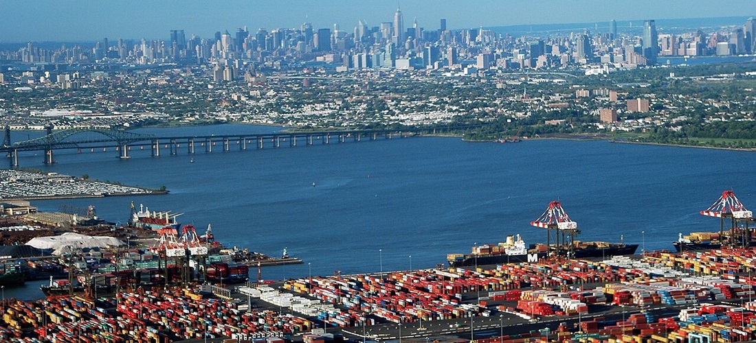 The island of Manhattan, Jersey City, Newark Bay, and areas of the New York / New Jersey Port seen from aboard a plane in July, 2005.